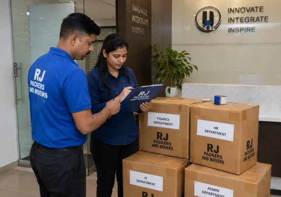 RJ Packers and Movers rJ Packers and Movers supervisor and office admin cross-checking file cartons and department labels before loading